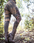 Rugged unbranded lace-up boots in dark brown leather with ankle straps and visible lace-up eyelets