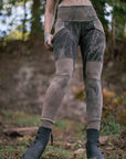 Rugged charcoal gray leggings with padded knee panels and gathered cuffs for outdoor wear