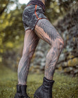 Limited Edition Sprinter Shorts crossfox unisex shorts black with orange trim and fabric print in outdoor light