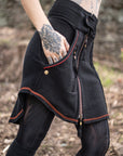 Unbranded black zip-front hoodie with red piping, textured knit cuffs and visible front zipper detail