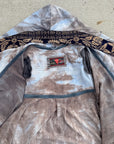 Soft gray tie-dye hoodie in cotton blend with navy and gold geometric hood trim and logo patch
