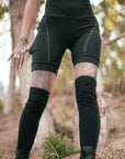 Unbranded black biker shorts in black cotton with contrast stitching and elastic waistband outdoors