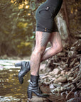 Rugged black denim jacket with flap snap chest pocket and short cuff buttons—outdoor wear