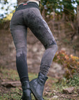 Rugged black riding boots with grippy tread and cuffed jeans for outdoor horse riding