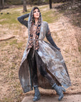 Bohemian hooded robe in washed gray with embroidered black-and-tan trim and tied waist outdoors