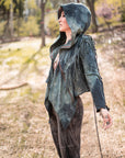 Worn-in unbranded hooded jacket in slate blue denim with fringe drawcord hood in sunlit forest