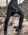 Black unbranded zip-up jacket with red piping and front zipper, shown outdoors in textured suede