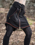 Textured unbranded black zip-up jacket with orange piping and front zippers outdoors