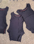 Limited Edition Hacci Tank Crossfox black ribbed tank top with frayed cap sleeves and red-trim neckline